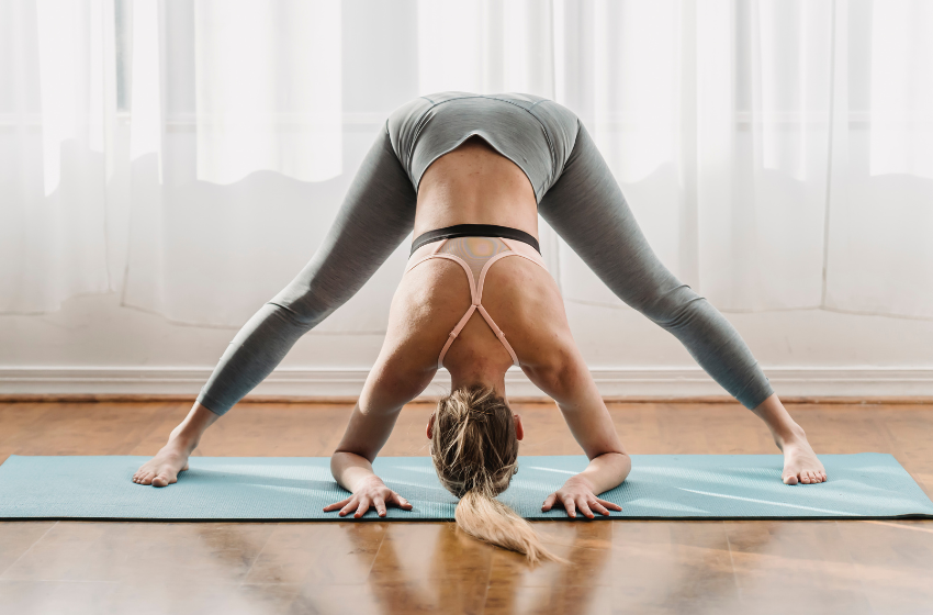 A woman doing one of the yoga poses for lower back pain