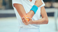 A tennis player experiencing tennis elbow.