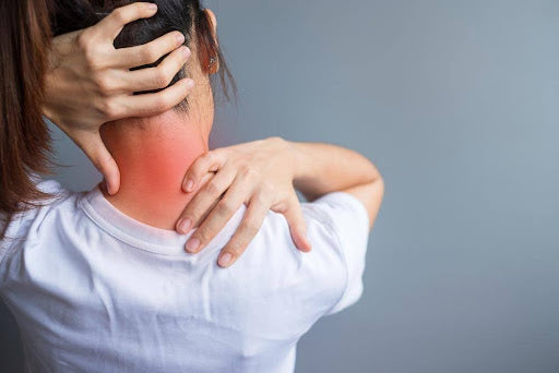 A woman learning how to get rid of stiff neck in 10 seconds.