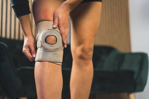 A woman wearing a knee brace for running.