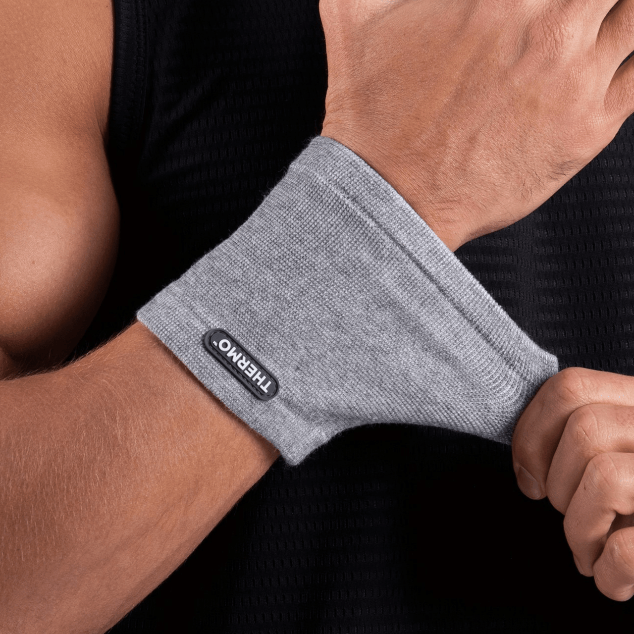 slider2:A man wearing a Thermo Wrist Sleeve for recovery